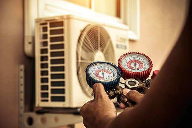 Professional Air Conditioning Service technician working in Madras, OR